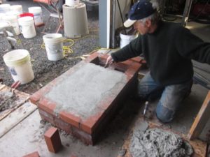 the mortared edge bricks provided a screed for a bed of mortar